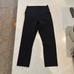 Lululemon size 4 leggings, black 23’ high rise worn a couple of times.